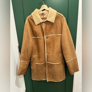 This shearling coat is made of 100% genuine leather and is a size S/M
